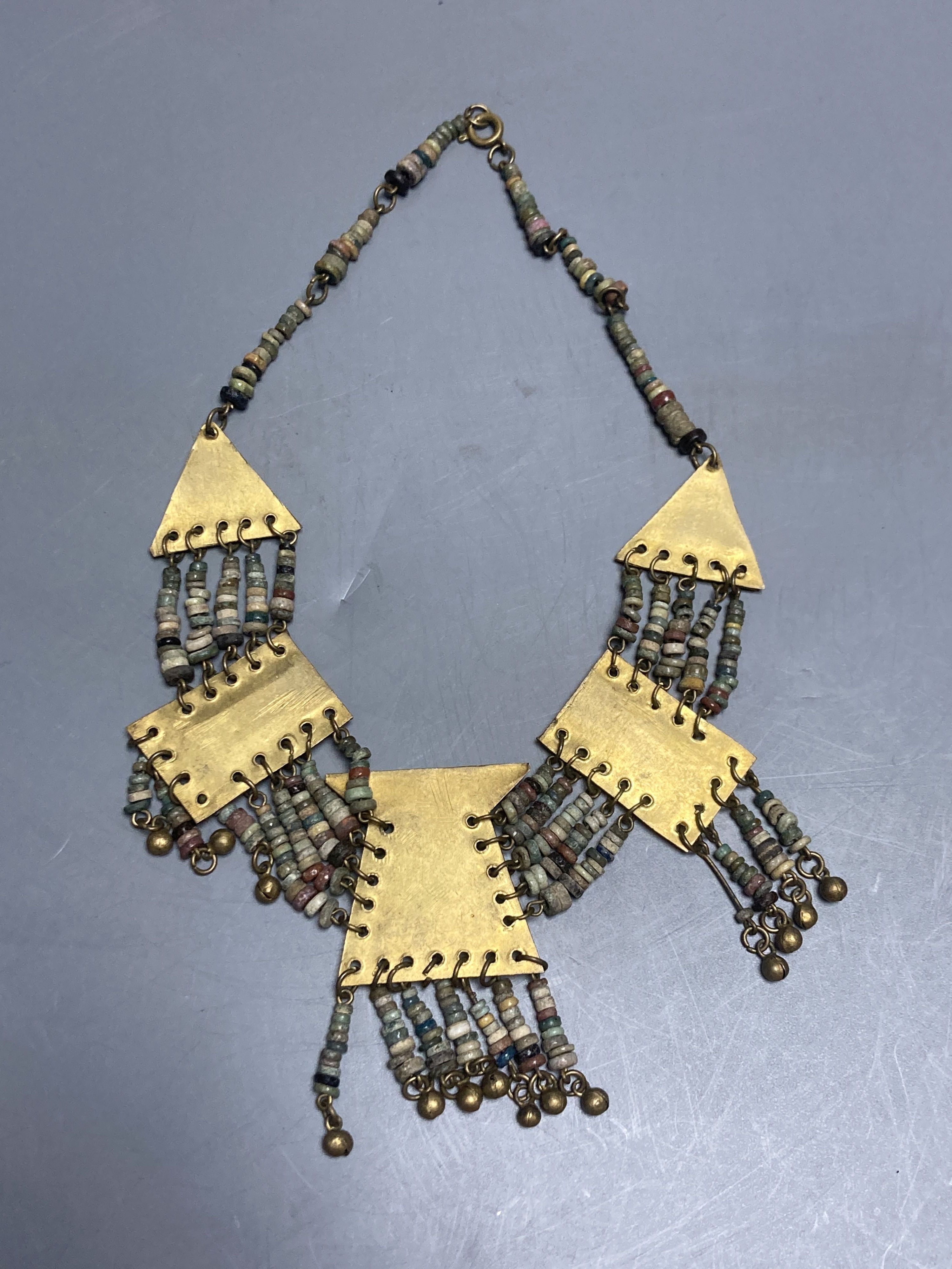 An antique Mayan? gilt metal and hardstone set drop necklace, 42cm.